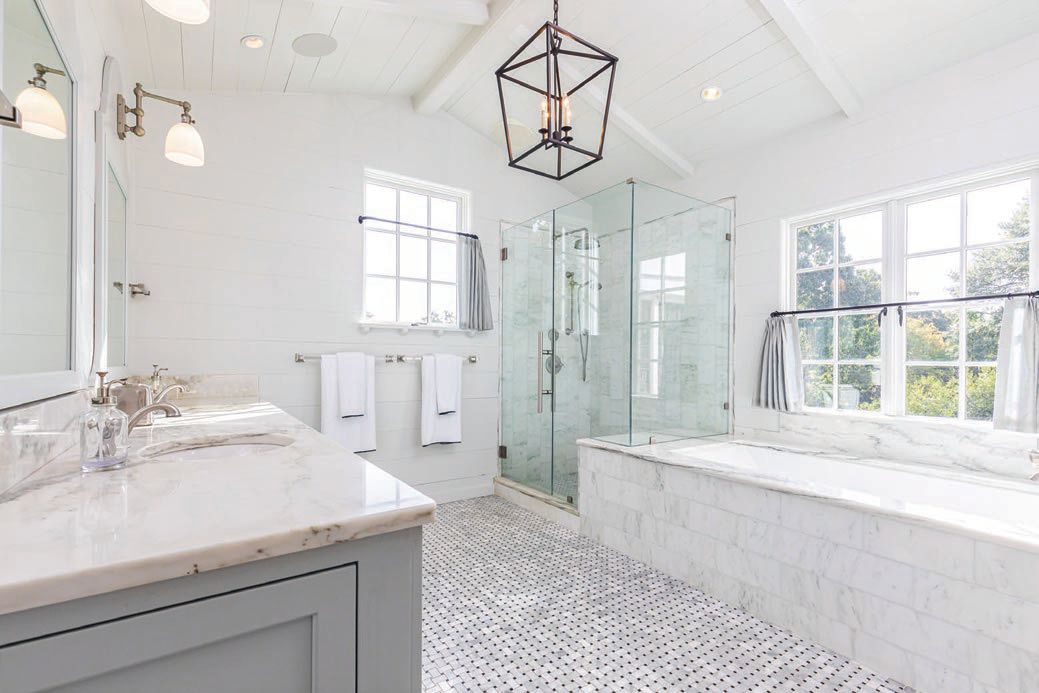 The spa-like primary bathroom with his-and-her sinks and oversize tub.