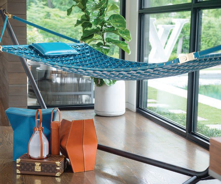 Louis Vuitton hammock and stools by Atelier Oï, Louis Vuitton Bell lamp and small trunk PHOTO COURTESY OF LOUIS VUITTON
