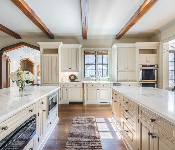 The kitchen features two separate islands with marble countertops and Bosch, Thermador and Sub-Zero appliances.