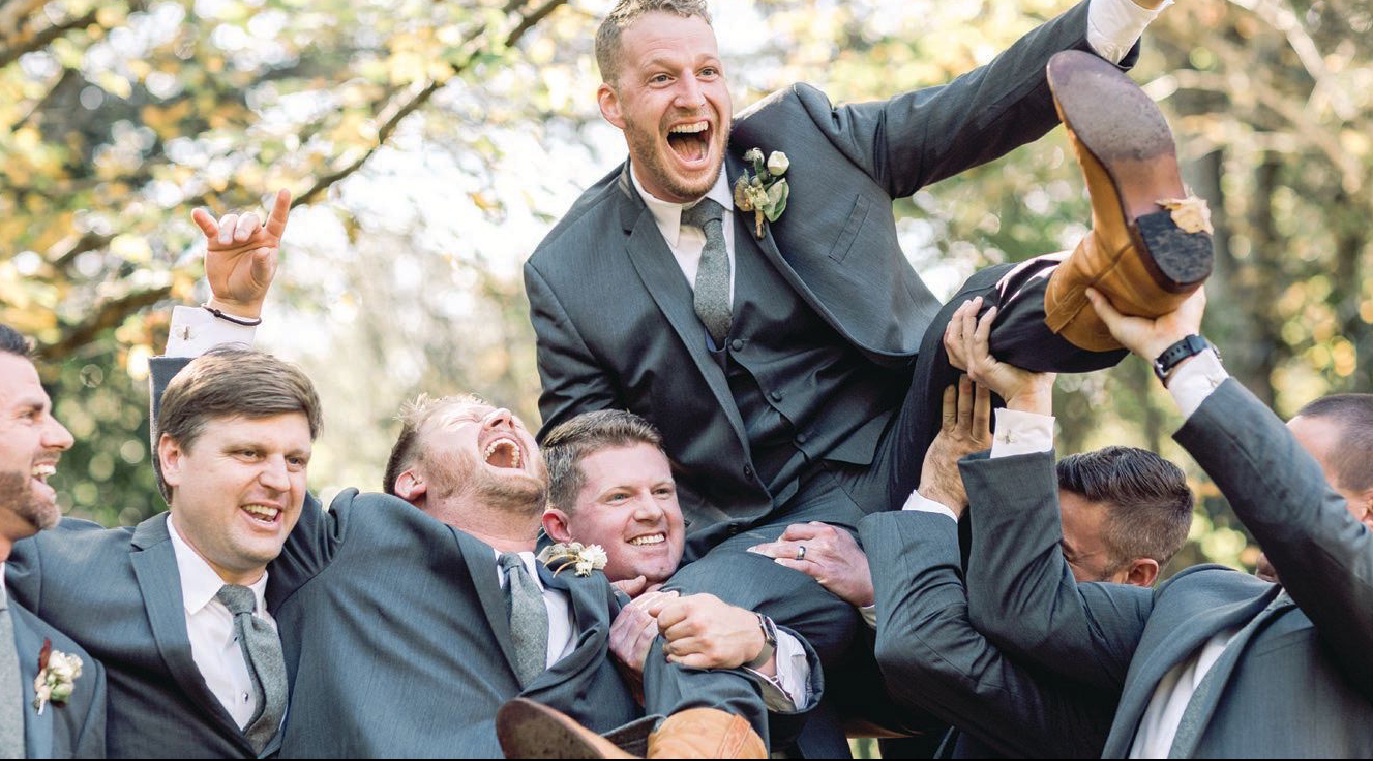 The groom enjoyed a laugh with his groomsmen. Photographed by Shauna Veasey Photography