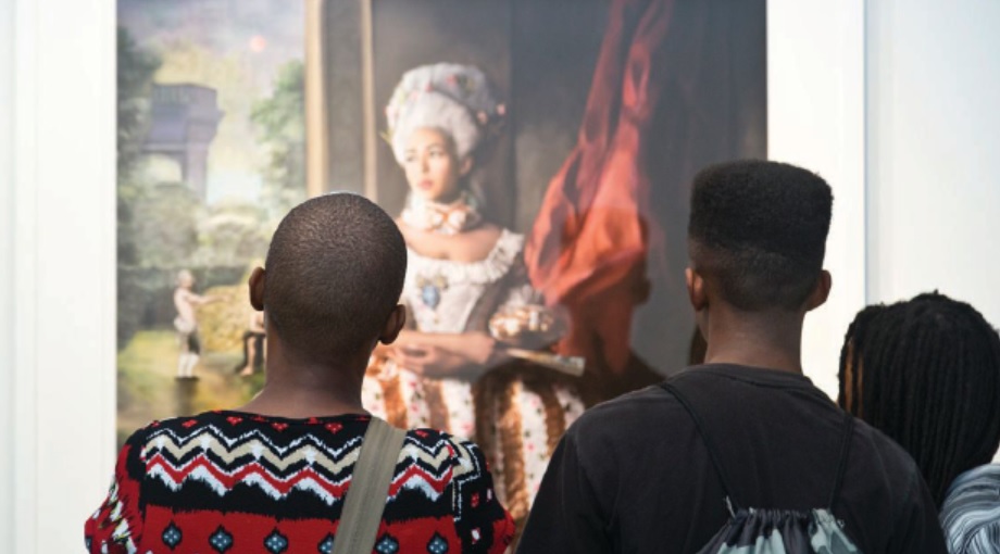 A group looking at Jean-Louis’ piece “They’ll Say We Enjoyed It”. PHOTO:BY DAVE KING/COURTESY OF ALAN AVERY ART COMPANY