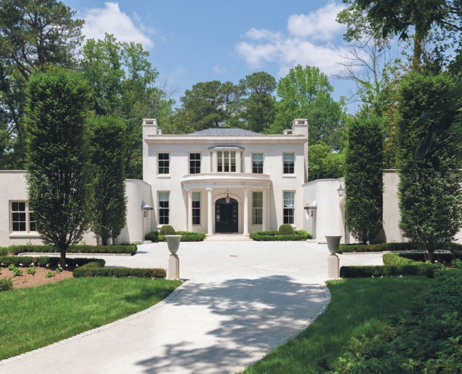 The facade of the home is designed in an English-Regency style. PHOTO COURTESY OF ENGEL & VOLKERS ATLANTA