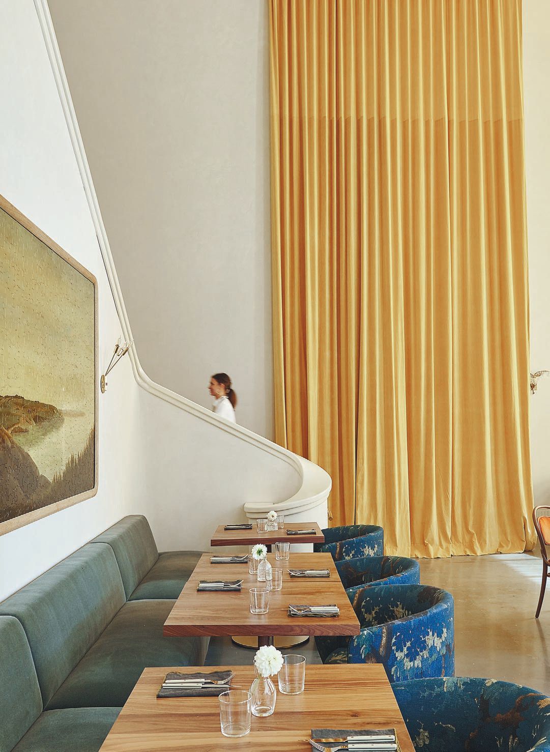 Hanging from the resto’s 25-foot ceilings are stunning hand-dyed velvet curtains inspired by chef Forough Vakili’s fond memory of harvesting saffron in fields near her childhood home in Iran PHOTO BY ANTHONY TAHLIER