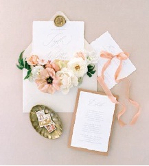The invitations were designed with simplistic, neutral coloring and fall accents. Photographed by Shauna Veasey Photography