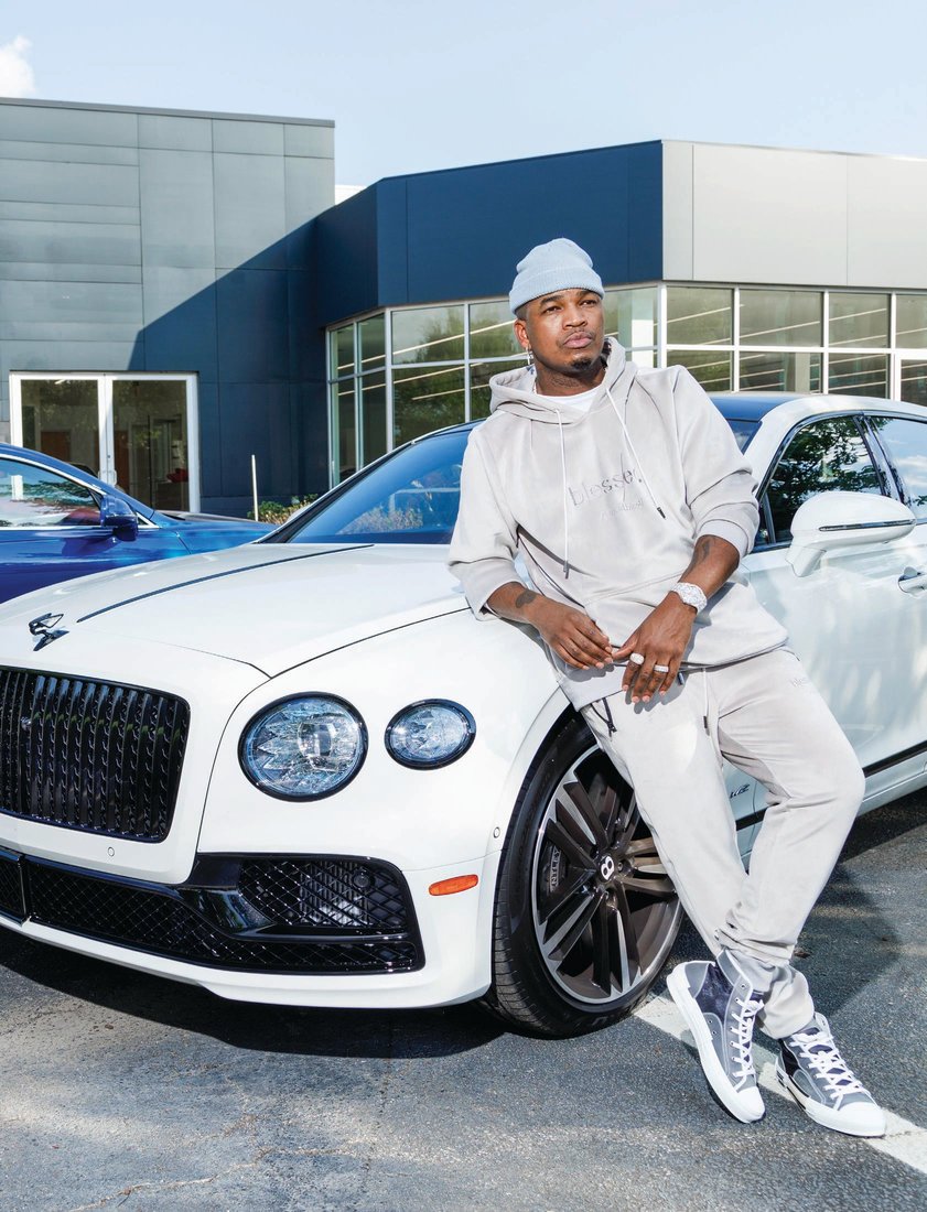 NE-YO with his own customized new white Bentley Flying Spur. PHOTOGRAPHED BY PATRICK HEAGNEY