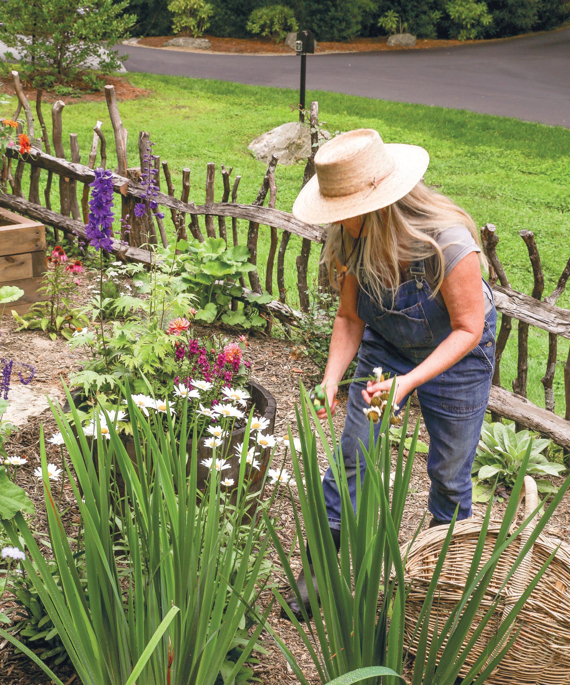 Half-Mile Farm’s Debbie Delany tends to the garden. PHOTO COURTESY OF OLD EDWARDS INN AND SPA