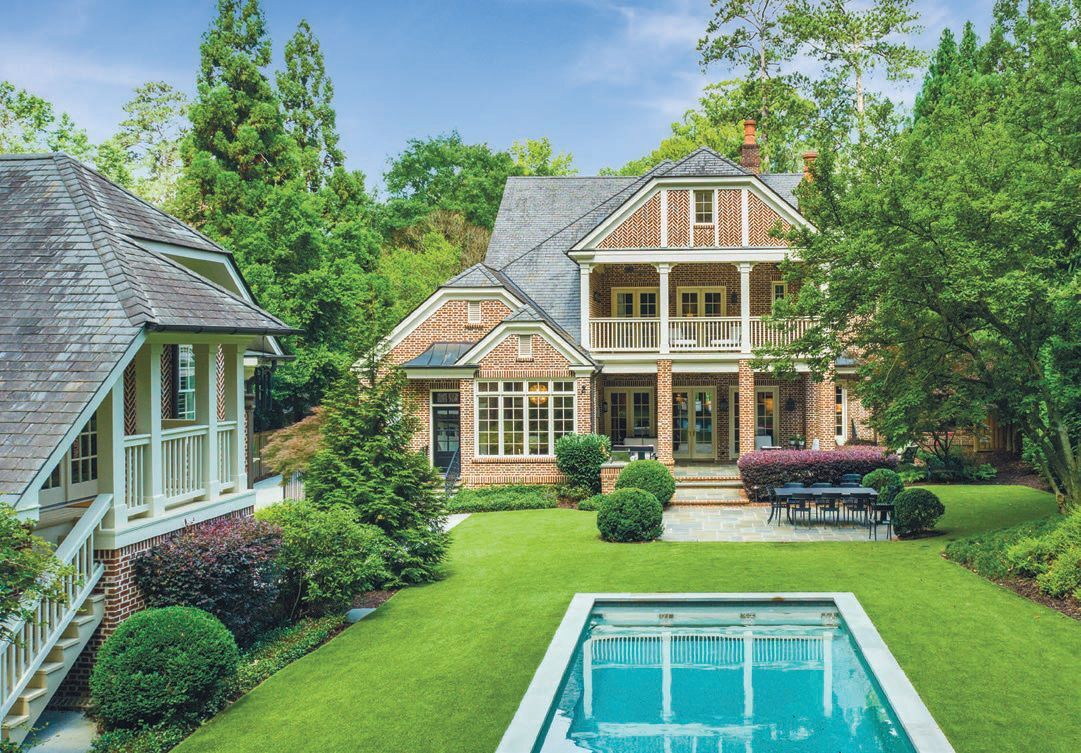This home’s backyard features a beautiful pool surrounded by artificial turf and a five-hole putting green. PHOTO: BY JOSH VICK/HOMETOUR AMERICA