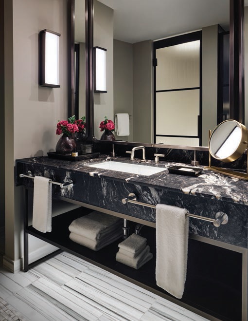 Guest room bathrooms feature stunning black marble vanities PHOTO BY DOUGLAS FRIEDMAN