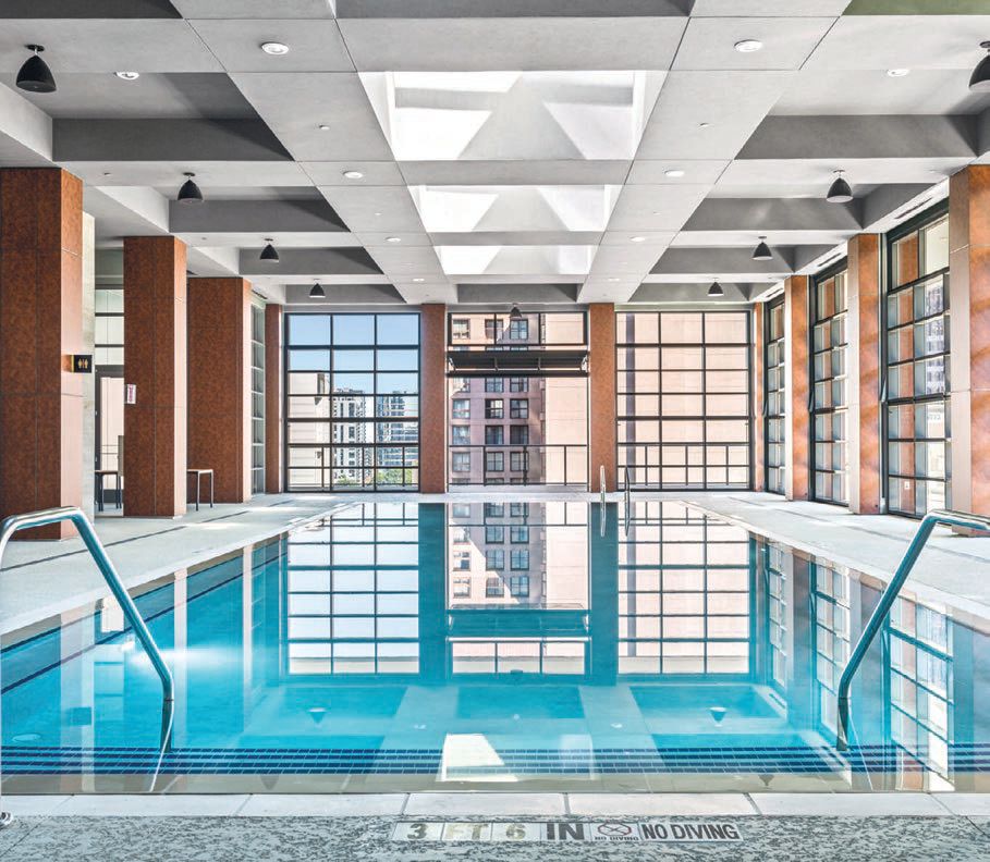 The Sky Terrace level’s sky-high indoor pool features fully retractable glass walls. PHOTO COURTESY OF ENGEL & VÖLKERS