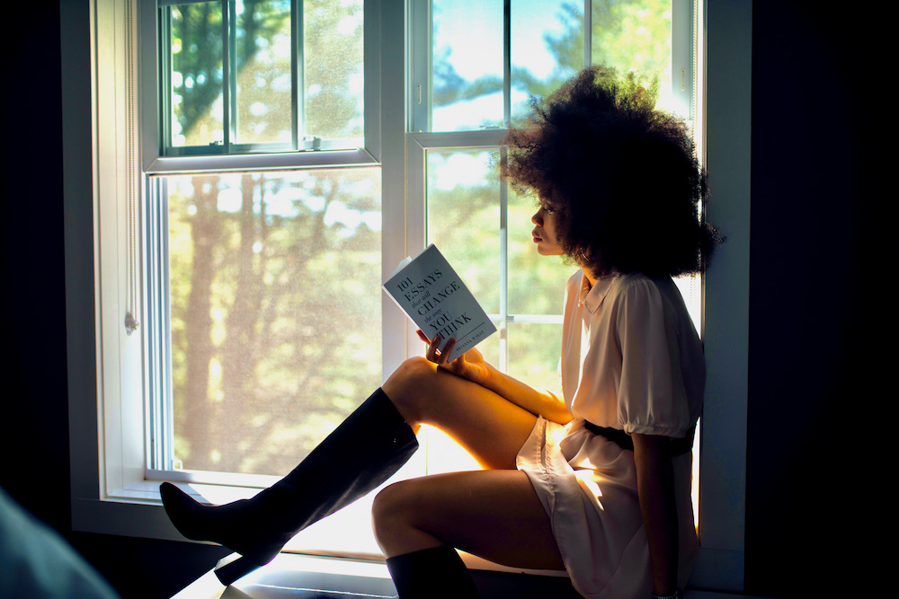 woman reading in a window